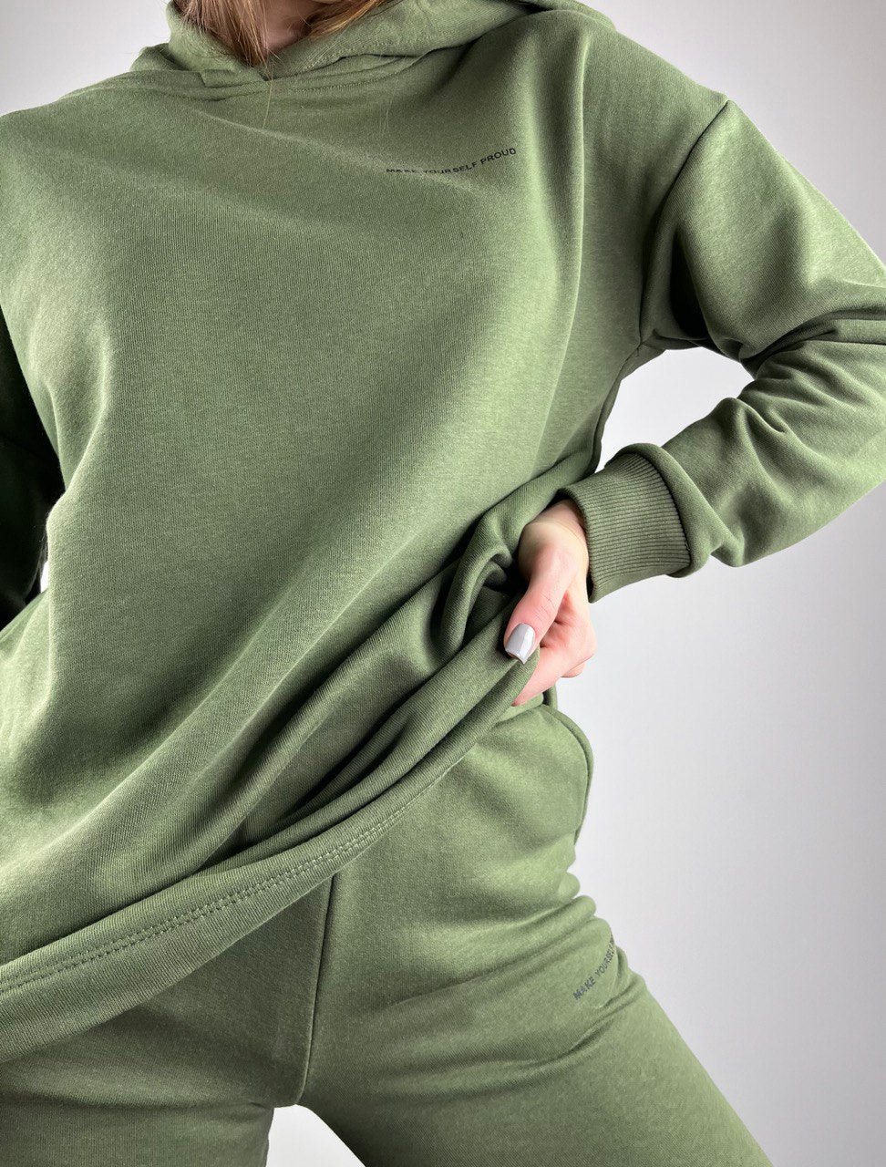 Zaļš trikotto uzvalks